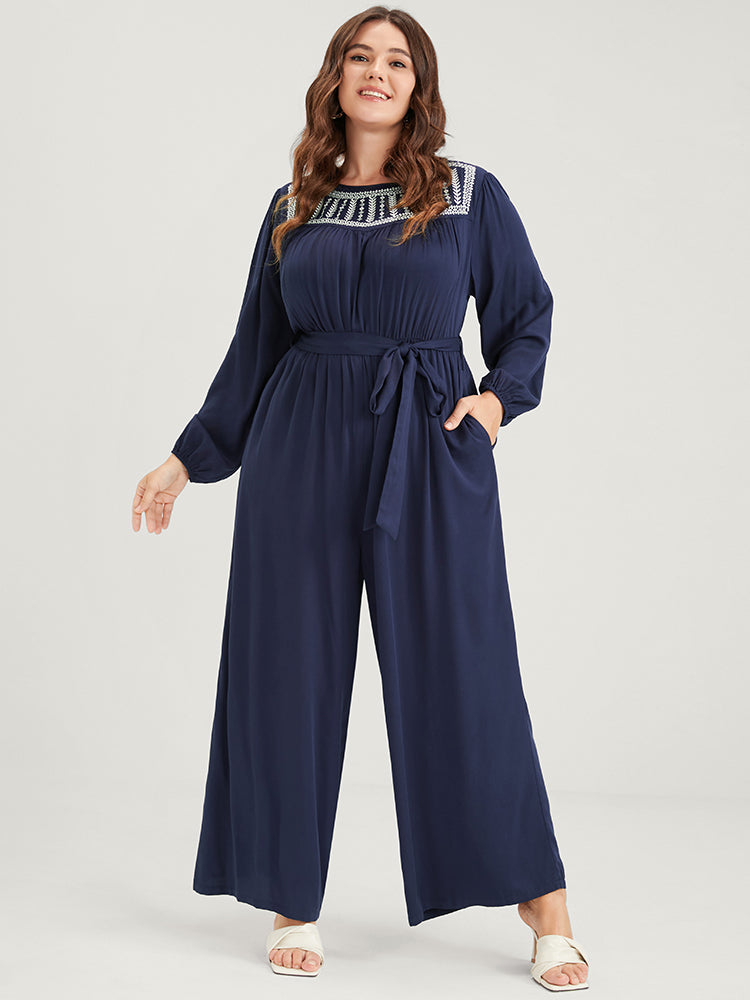 Solid Pocket Lantern Sleeve Embroidered Belted Jumpsuit